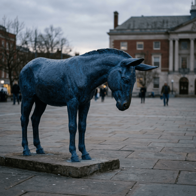 Dark blue bull sculpture in a historic city square